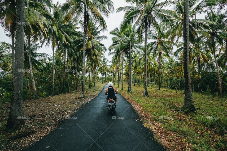 Biking around remote Indonesian islands washed under tropical rains