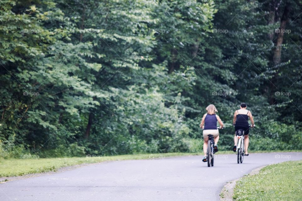 Adults on bikes