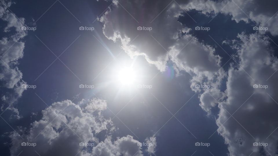 sun behind the cloud