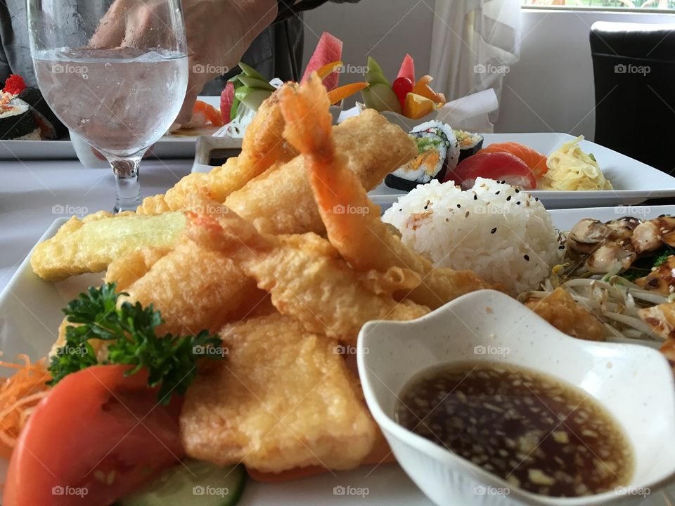 What's cooking tonight? Selfish traditional Japanese food with prawns tempura, sukiyaki, sushi, maki, rice, vegetables all fresh and organic