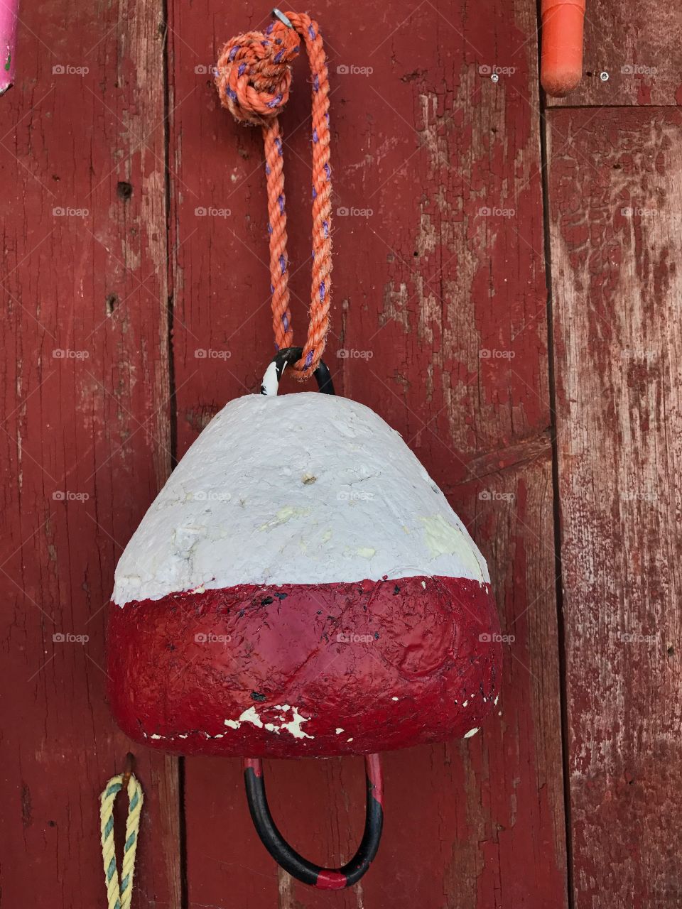 Old concrete red and white boat fender bumpers