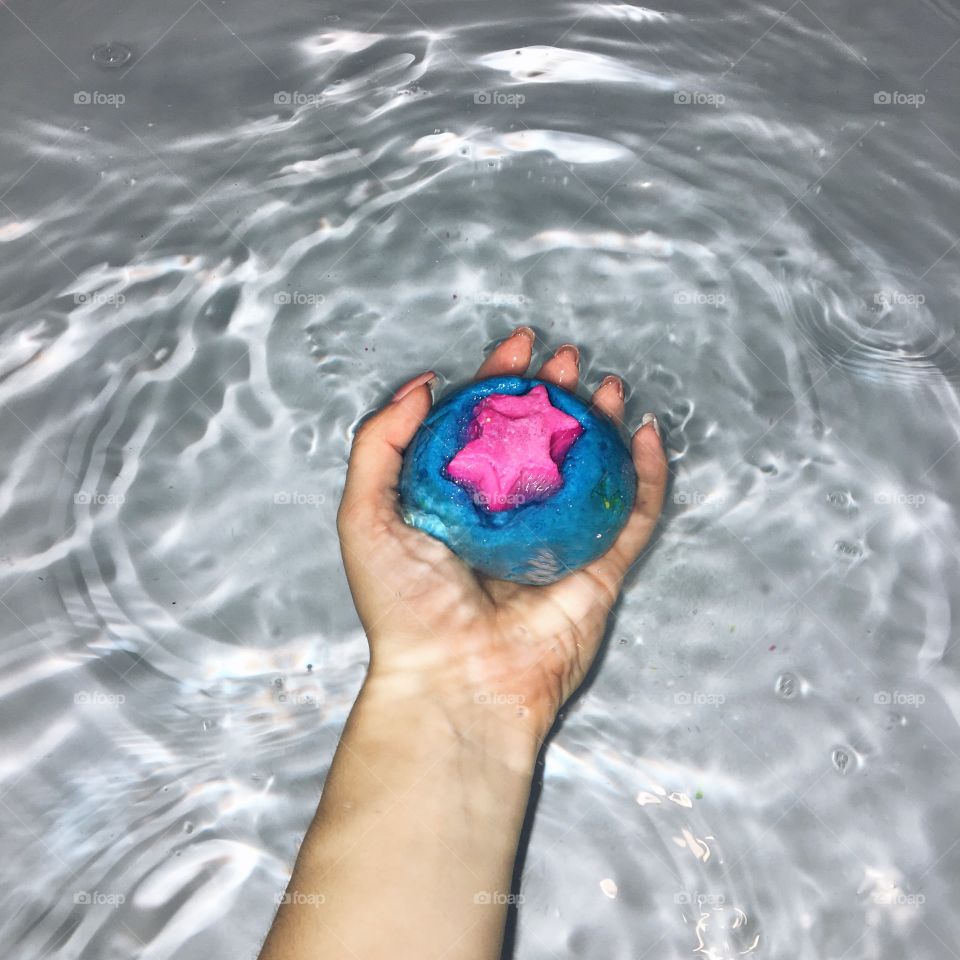 Bath bomb in a hand 