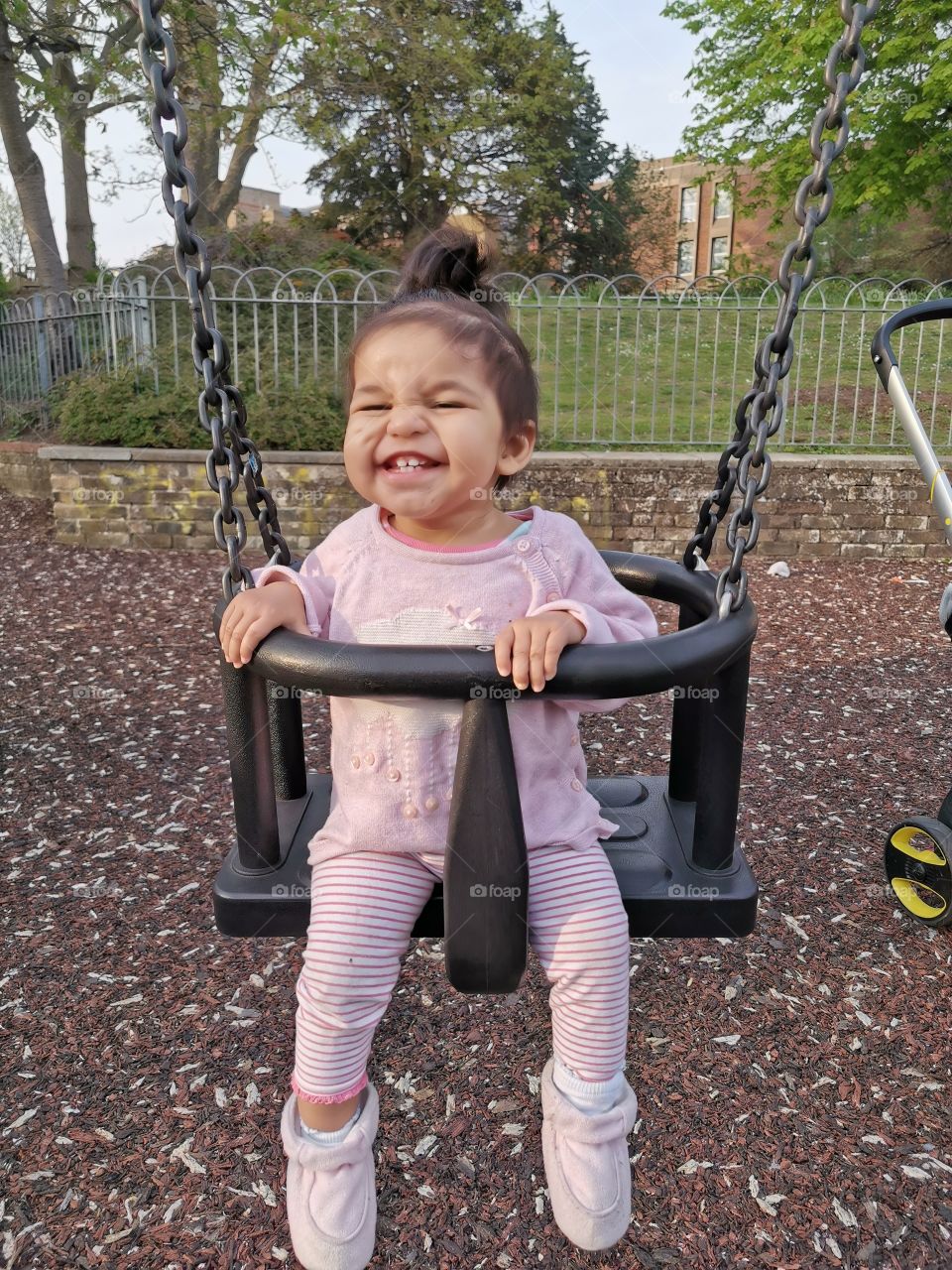 Happy swinging baby