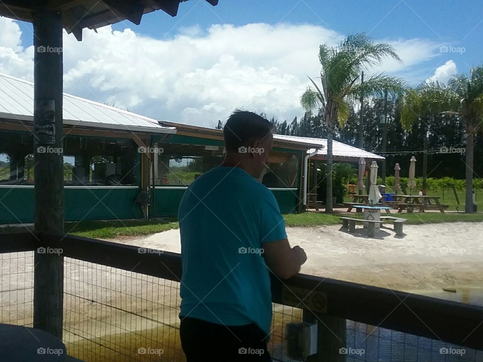 A man in Florida on vacation at a vineyard.