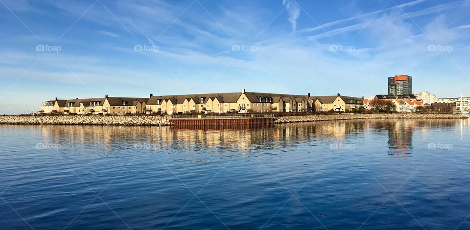 Scenic view of a sea in front of house