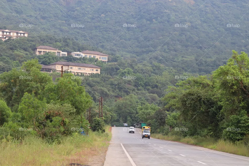 long road and hill town.