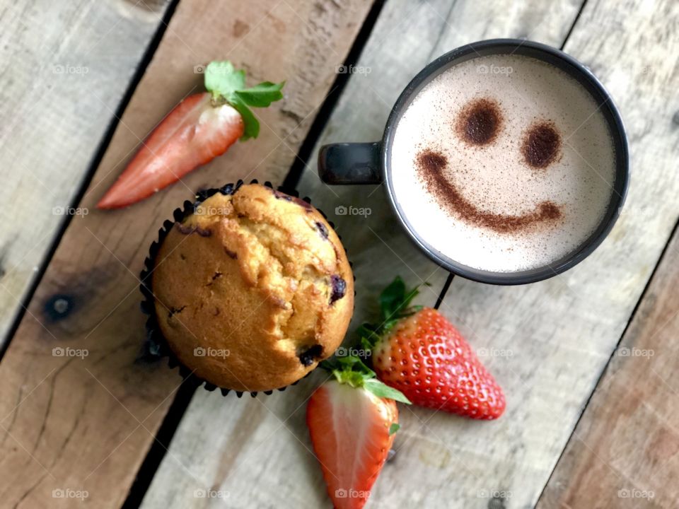Chocolate muffin, strawberries and hot chocolate 