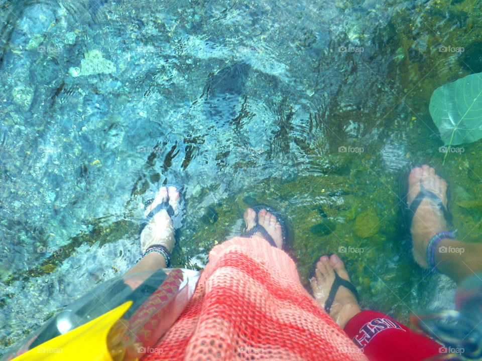 Feet in river