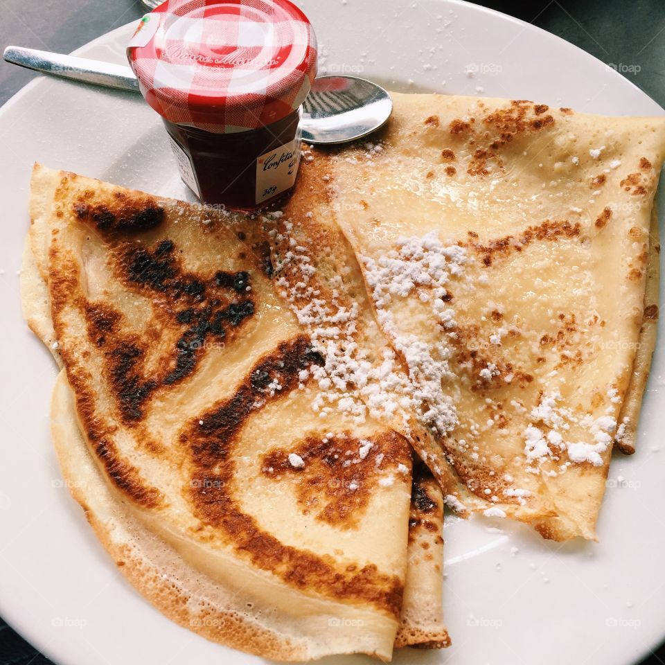Crepes with jam on plate