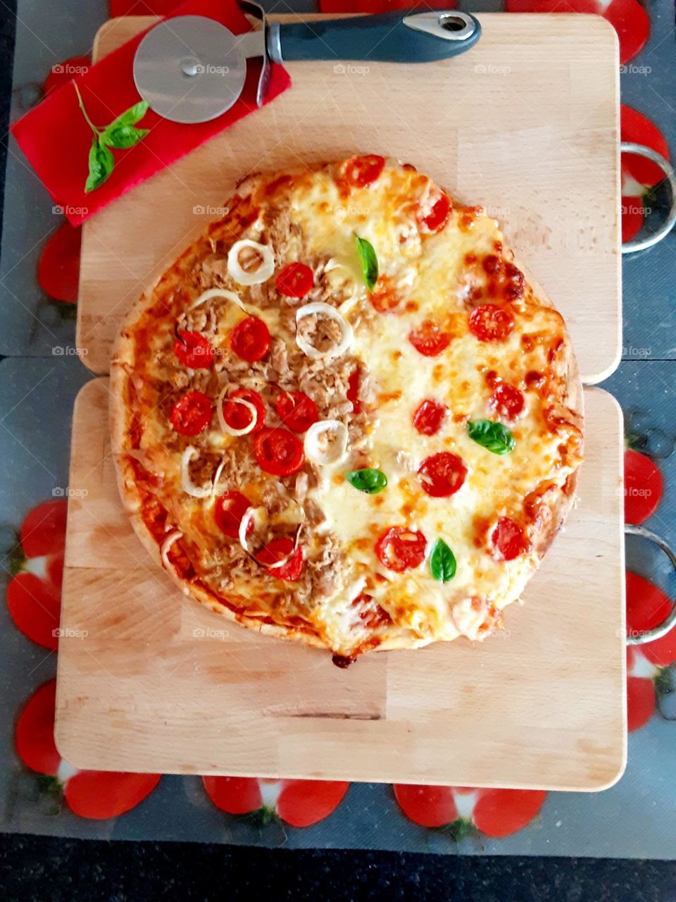 delicious Pizza with tomato on a wooden board