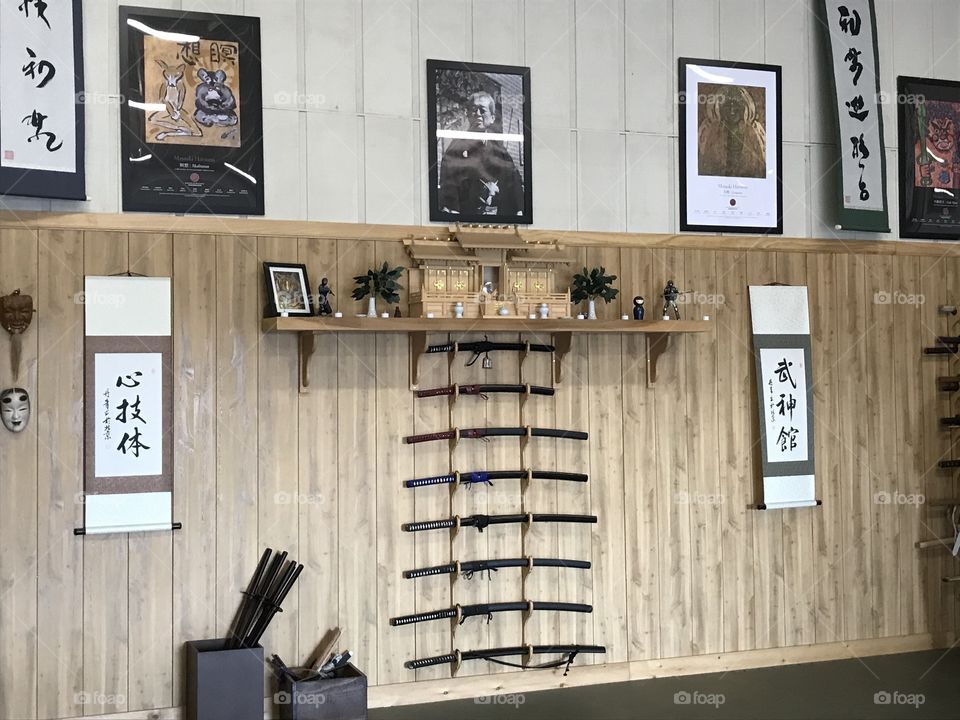 Inside a Japanese martial arts dojo. It certainly does have a Japanese atmosphere when practitioners enter to train. Because of this unique environment, they would feel right at home. In a sense, it is a Japanese home away from their American home.