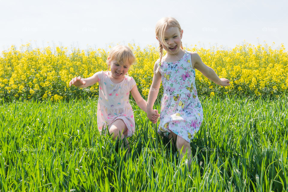 Two sibling running in farm