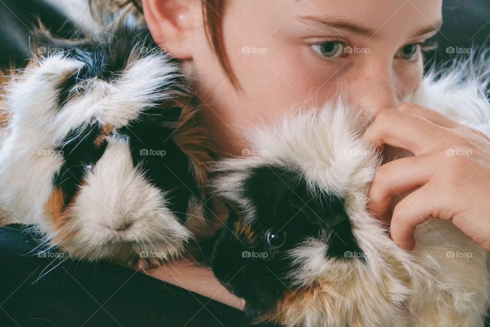 Girl with her guinea pigs