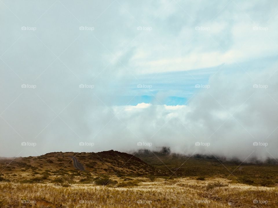 Above clouds top of the volcano 