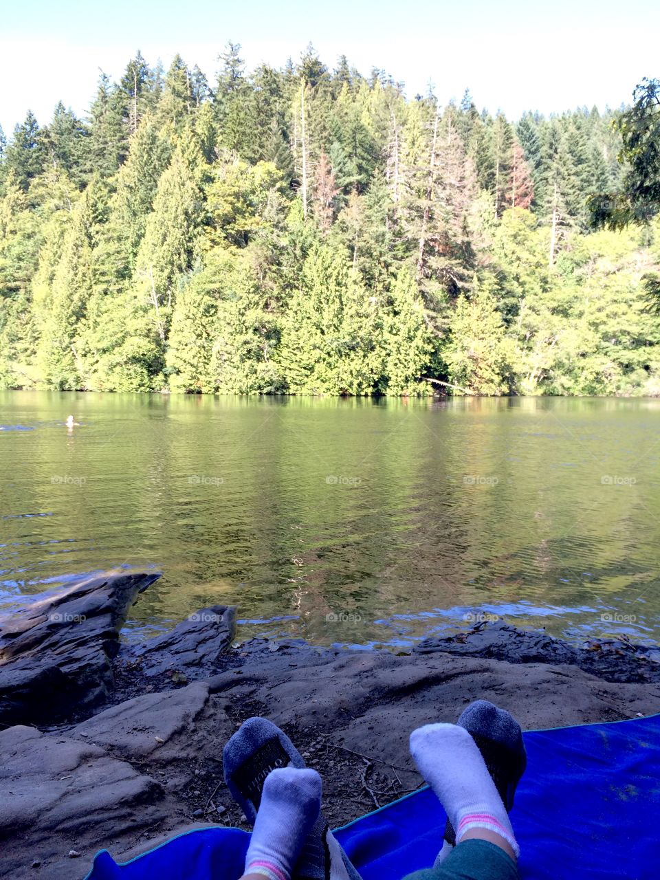 Toddler resting on Mommy after a long hike