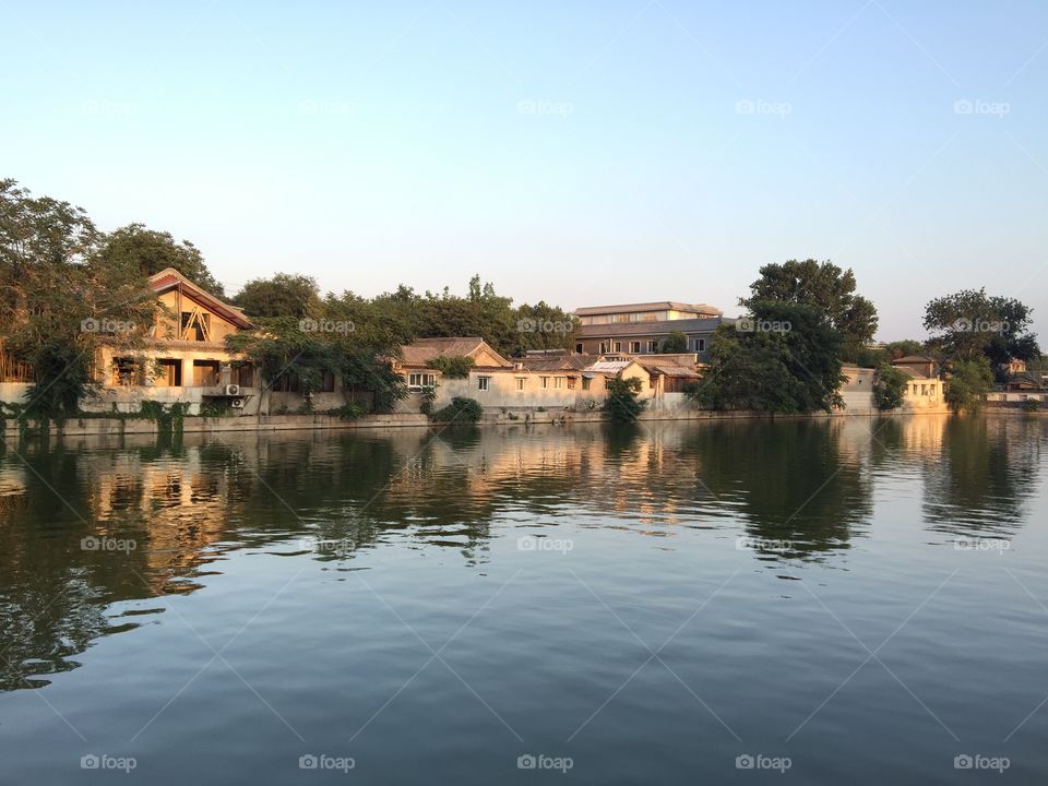 Scenic view of houses near lake
