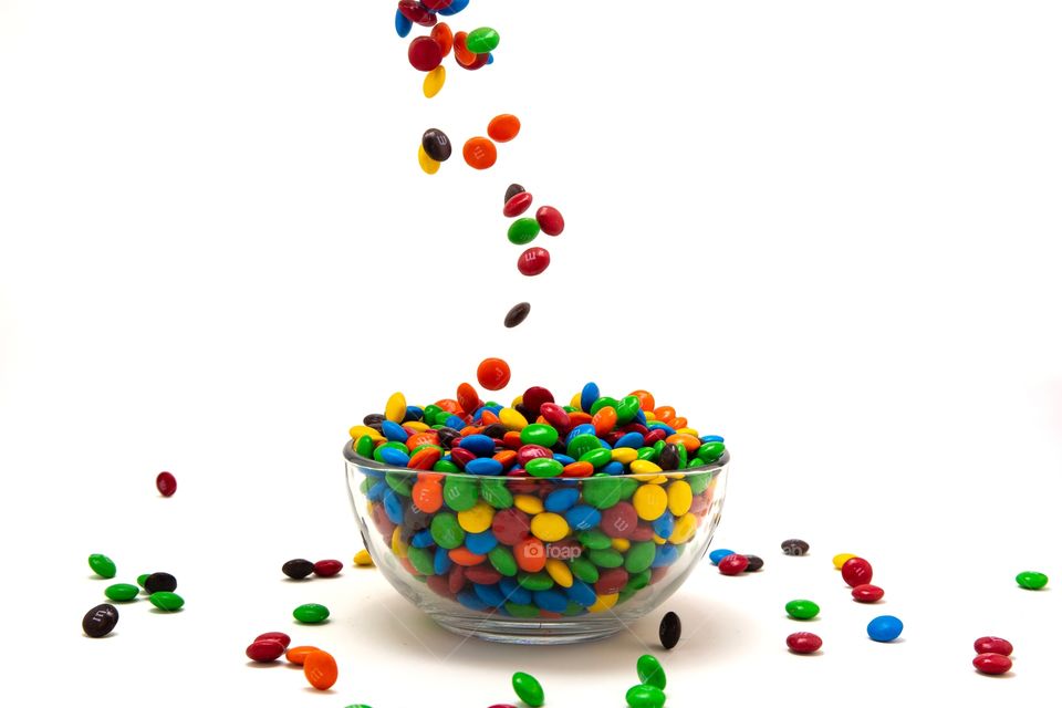 Spilling M & M Candy into a Bowl