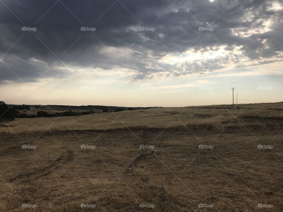 Large grey clouds and blue sky over the plains 