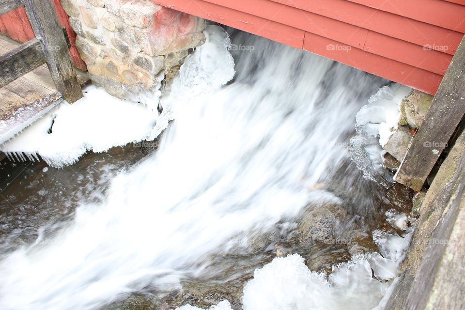 snow ice and water under the mill