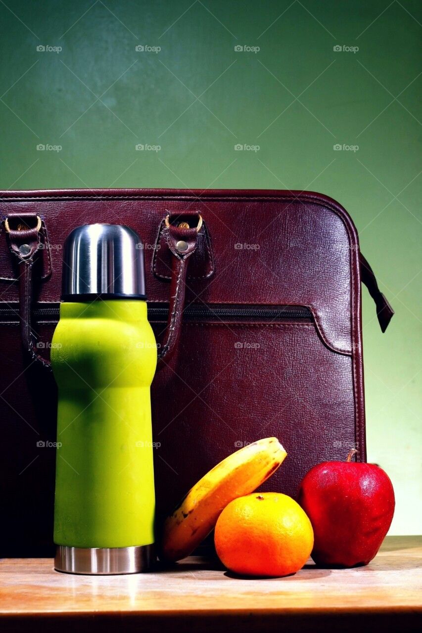 Flask, fruits and a briefcase