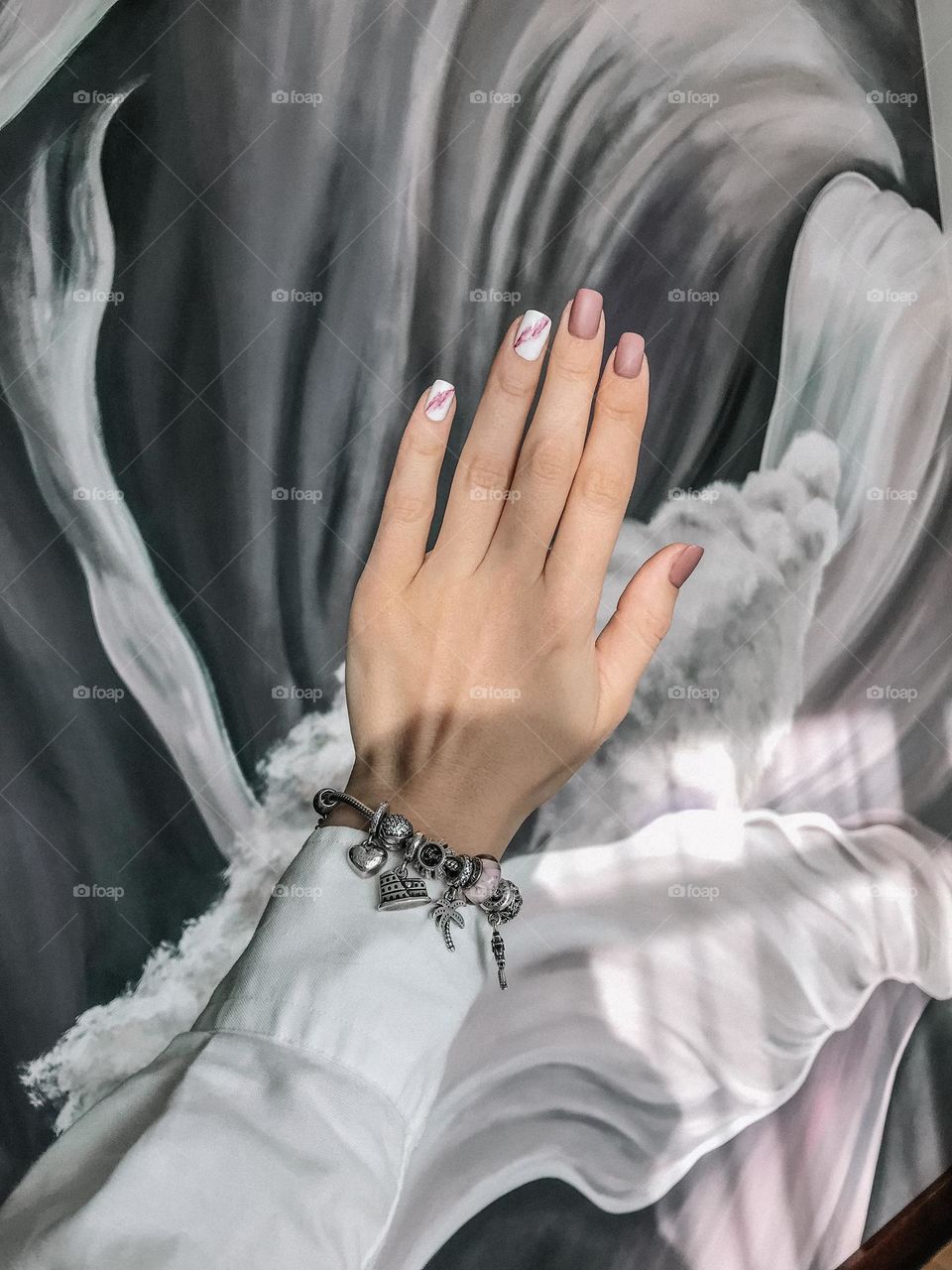 Woman manicure against pastel background. Female beautiful nails. 