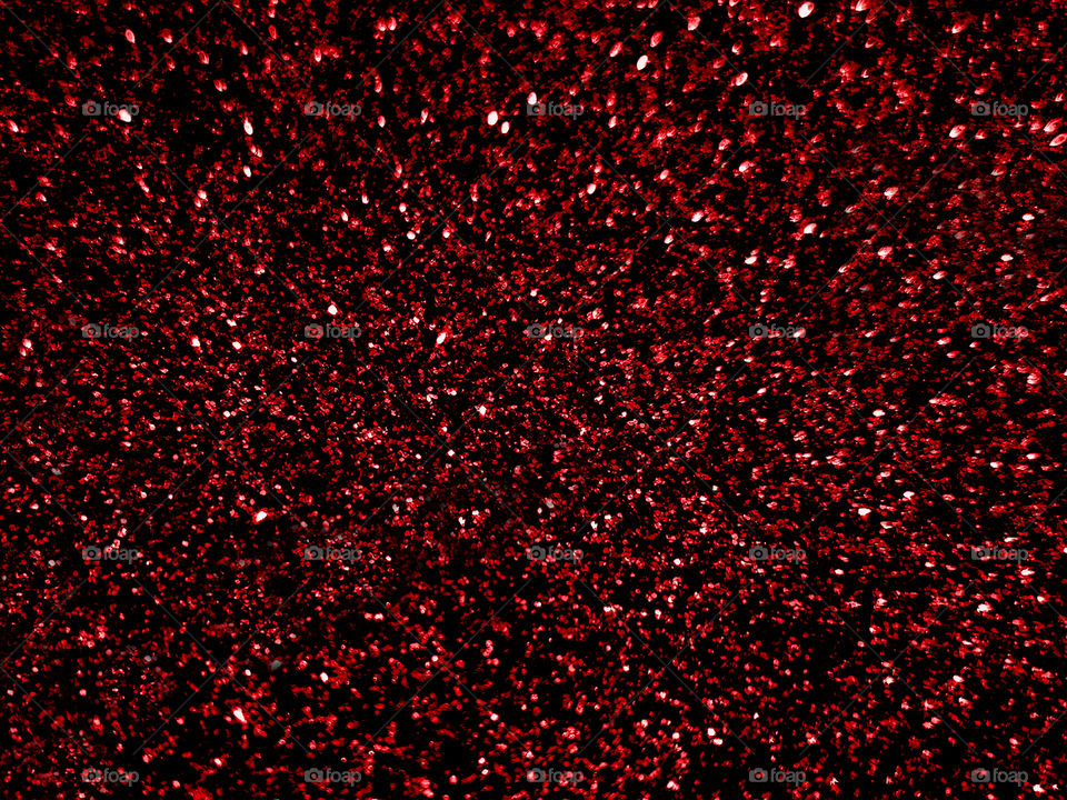 Abstract red glitter light sparkle texture background. Concept for Christmas, New Year, Celebration background.