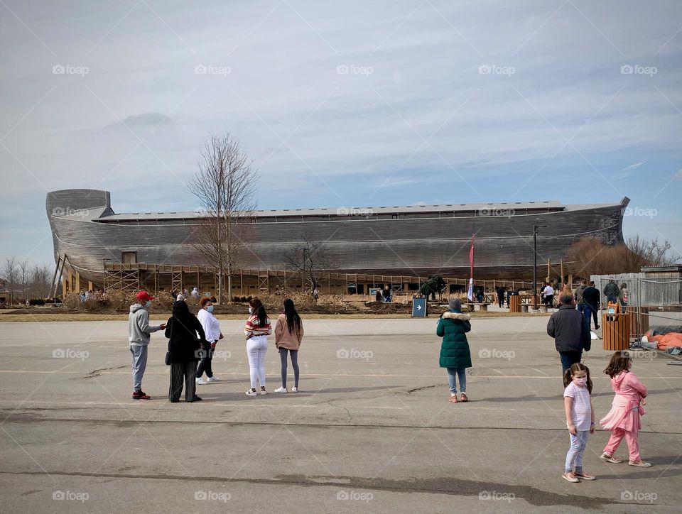 Noah’s ark at the Creation Museum in Kentucky with many visitors enjoying the scenery and excited to see such a humongous real life ark spanning 510 feet long, 85 feet wide, and 51 feet high as describe in history through Scriptures.