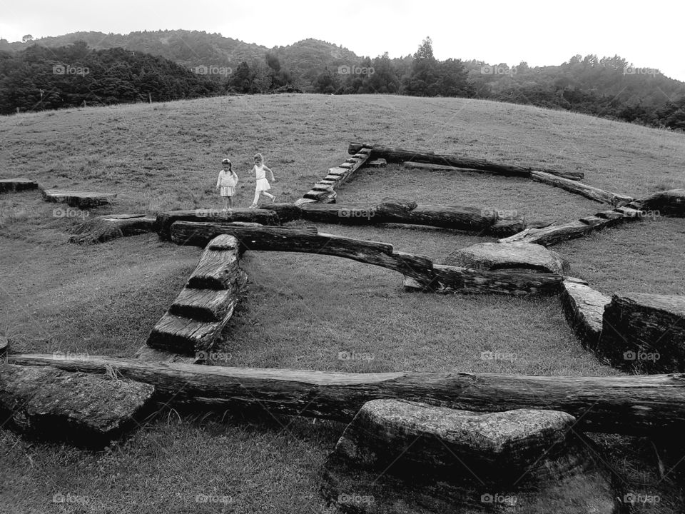 Children playing on rustic playground