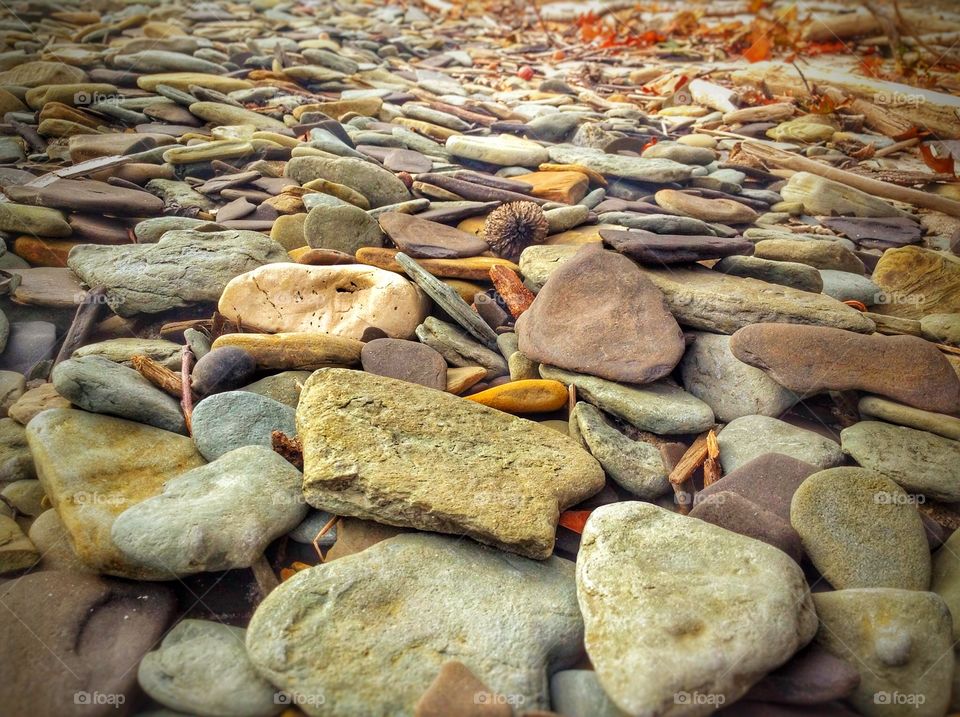 Pebbles . Rocks carved by its own creator, the lake.