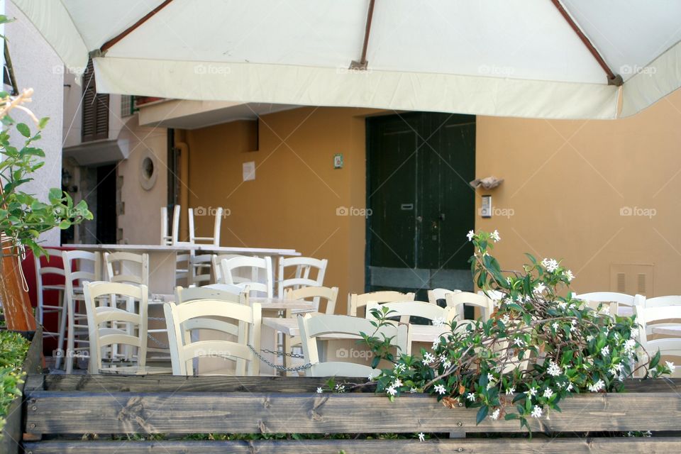 White chairs in empty restaurant