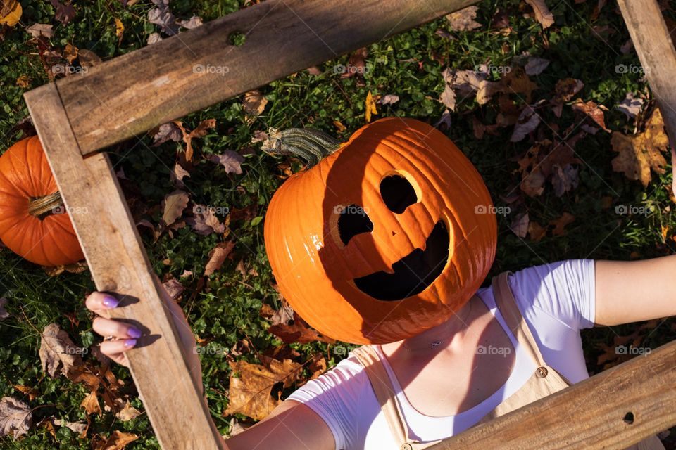 Framed Happy Pumpkin laying in the leaves