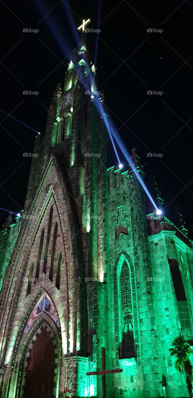 Green illuminated cathedral in Canela, Brazil