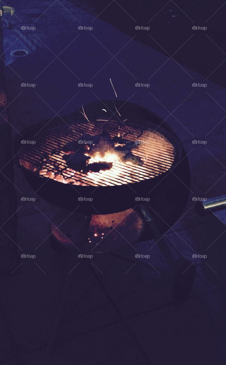 Fire in a barbecue at night