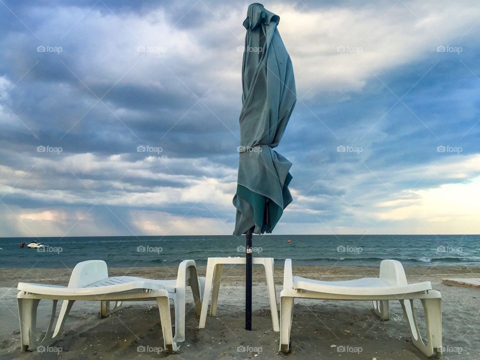 Lounge chair and beach umbrella