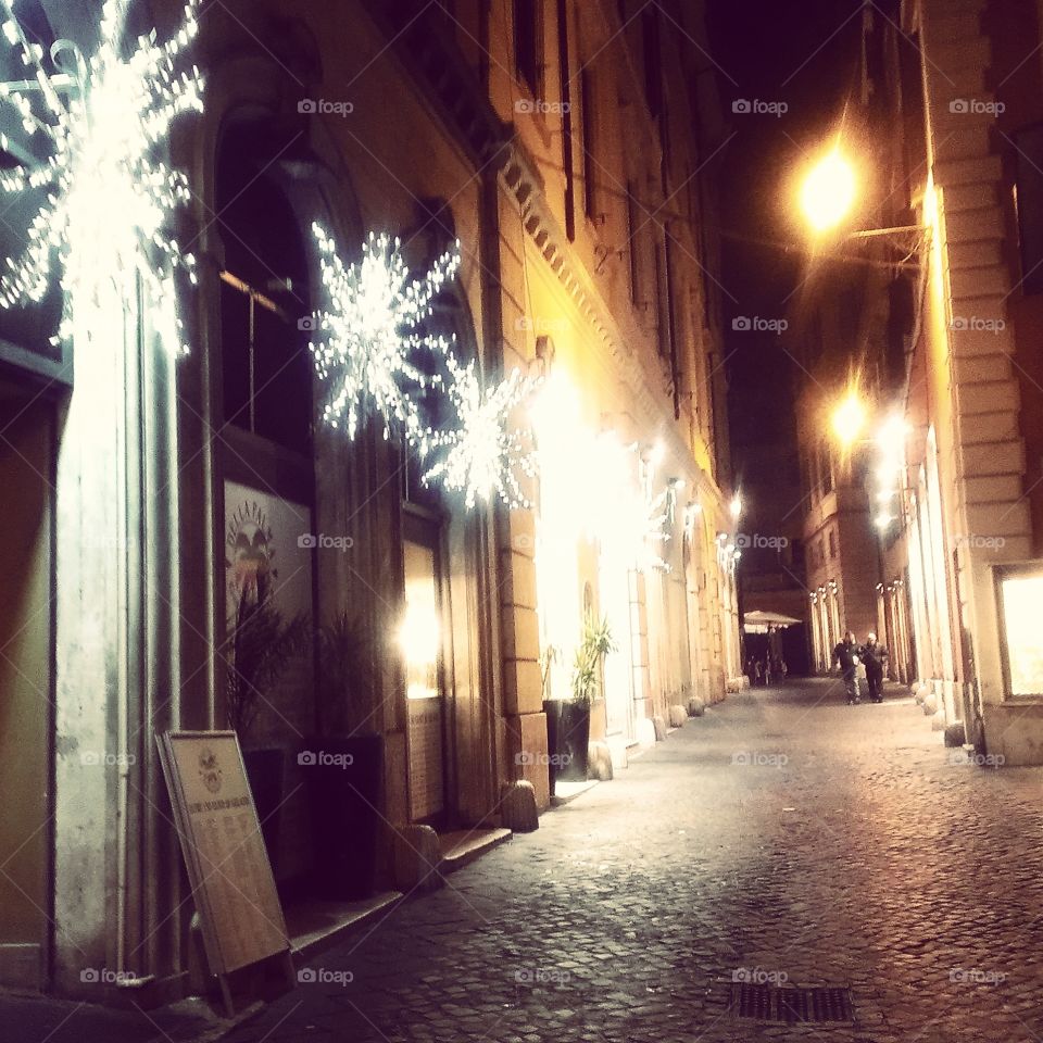 Christmas in Roma. Sidestreets of Rome at night, during the holiday season. 