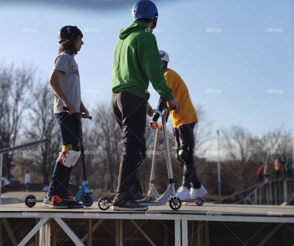 Kids playing scooter outside