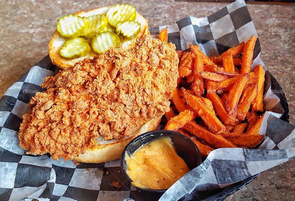 Giant Spicy Chicken Sandwich with Sweet Potato Fries and a side of Spicy Mayonnaise Sauce