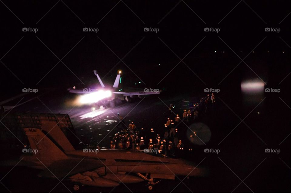 Night Ops Badassery. Jet taking off from flight deck at night
