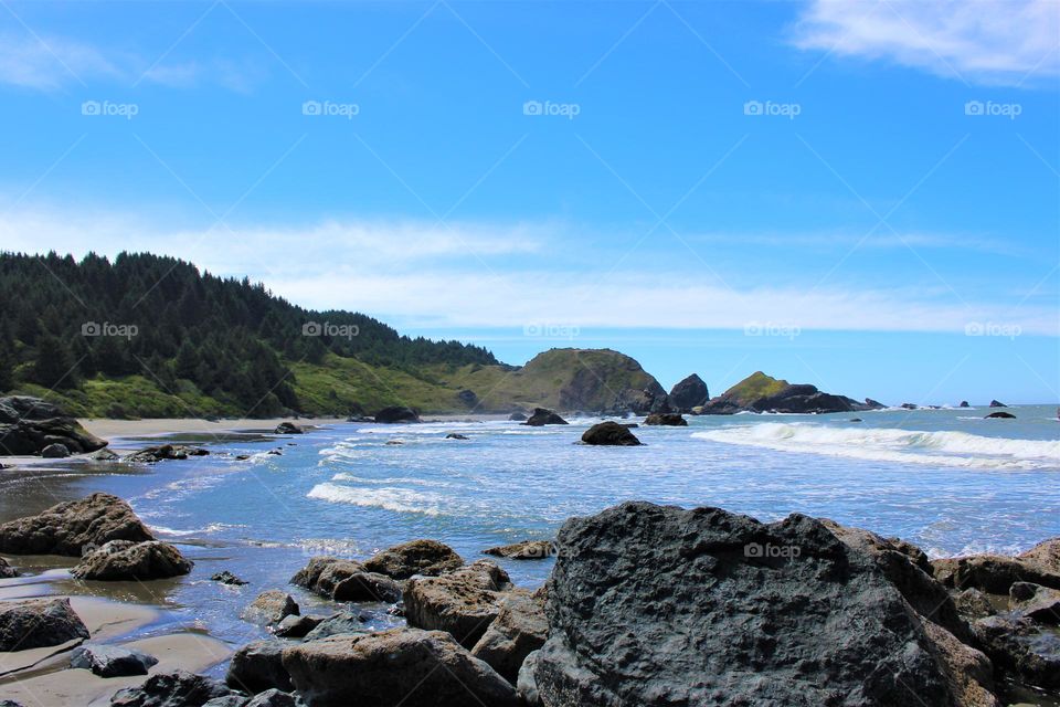 Waves crashing along a rocky shore; West Coast