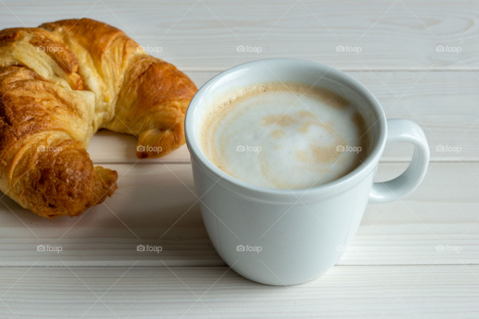 cup of coffee and croissant