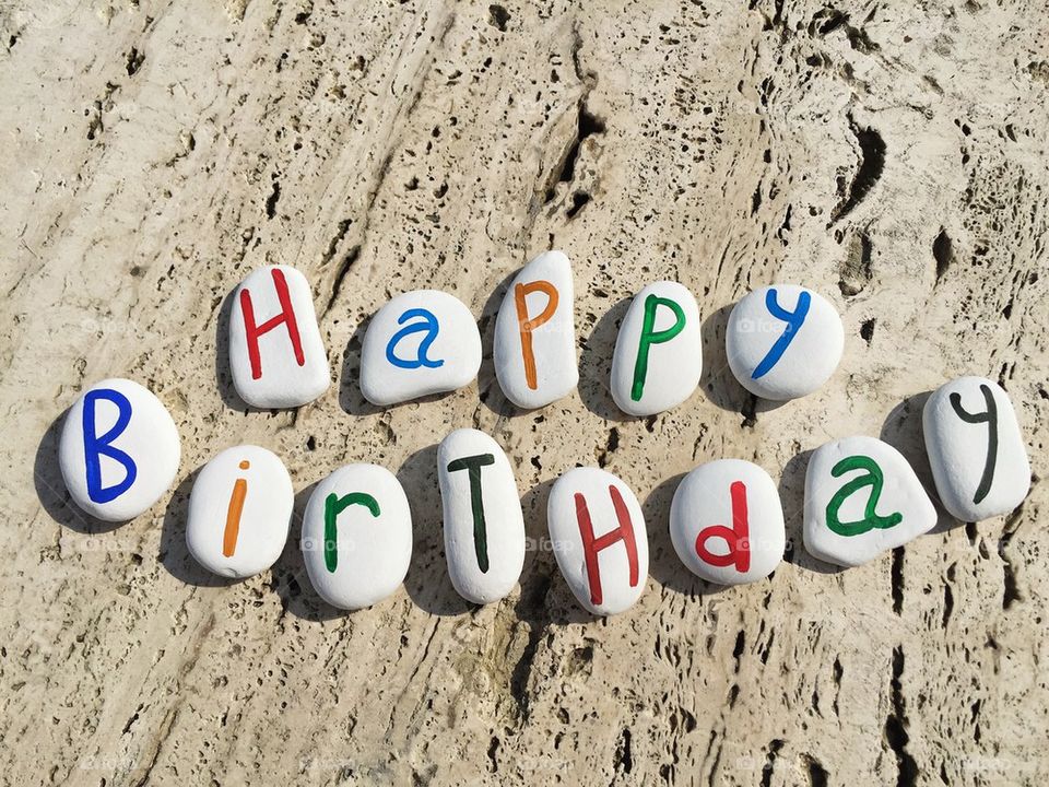 Happy Birthday greetings on colored stone letters