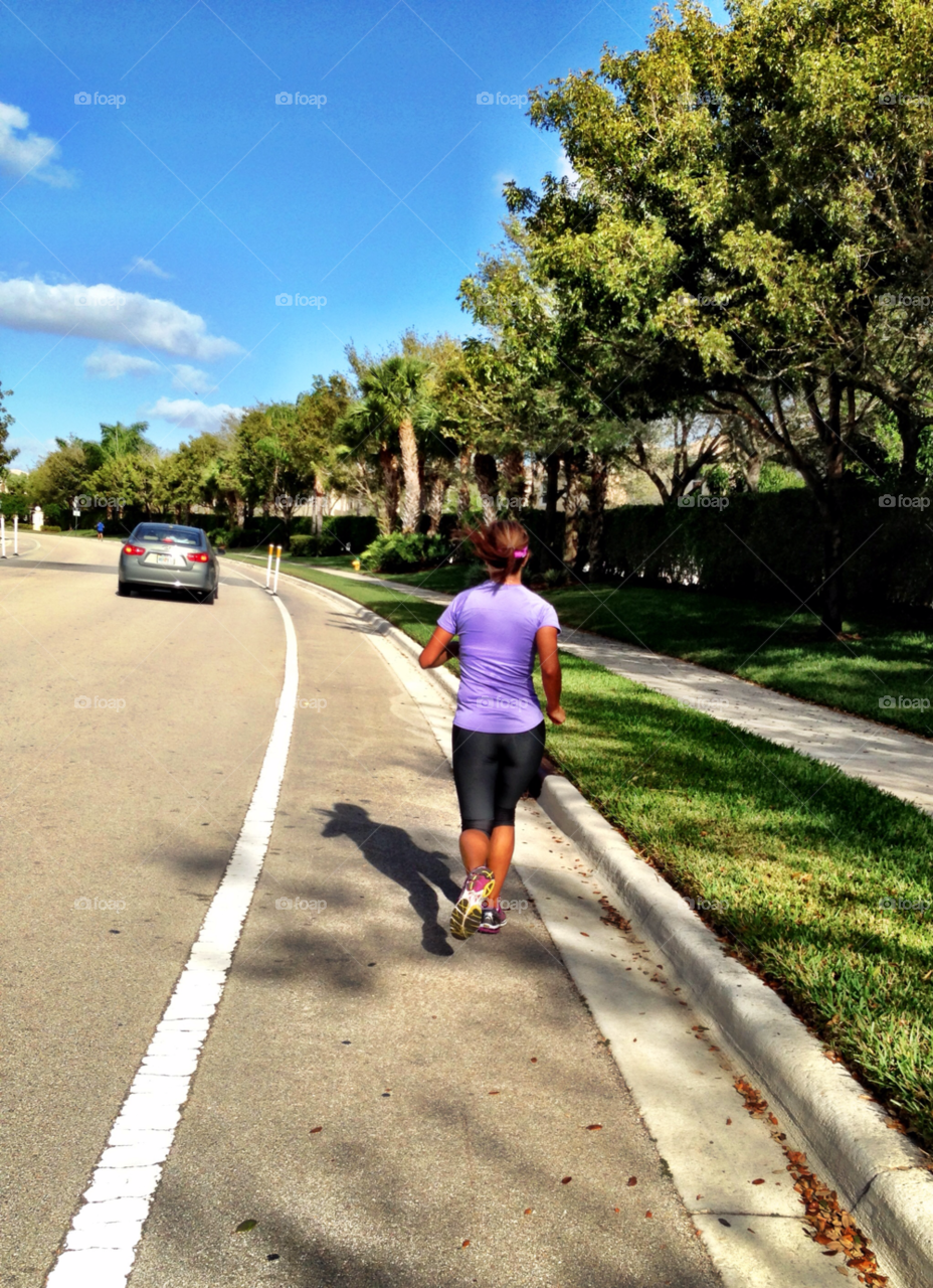 Running. Woman running on the street