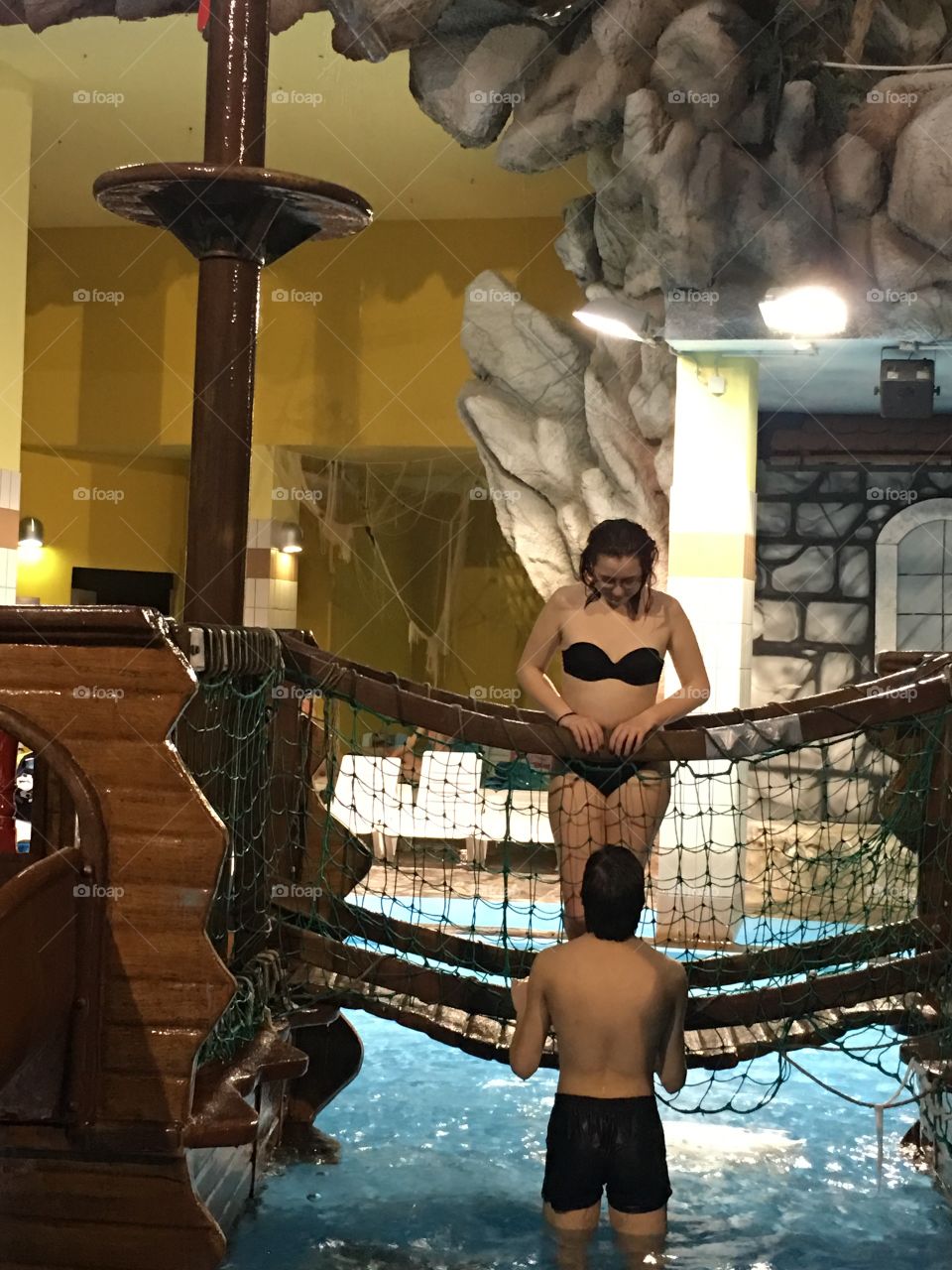 Couple at indoor swimming pool