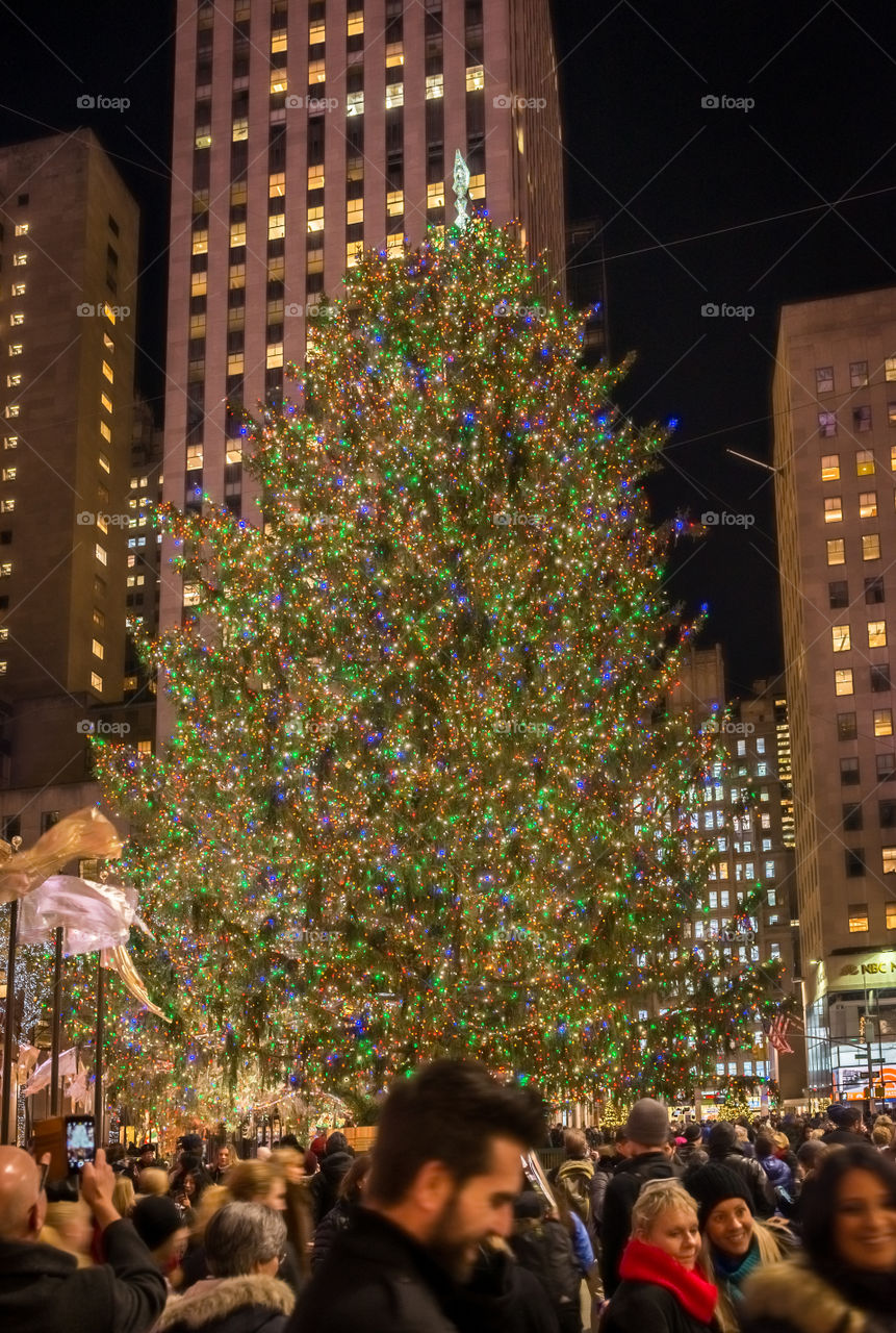 Lit Christmas tree in Rockefeller Center in New York at night