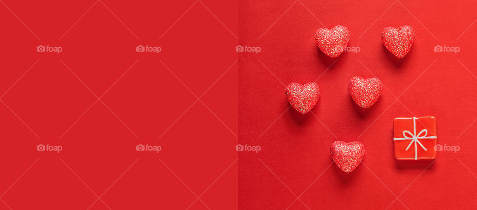 Postcard. Red hearts on a red background. Valentine's Day.