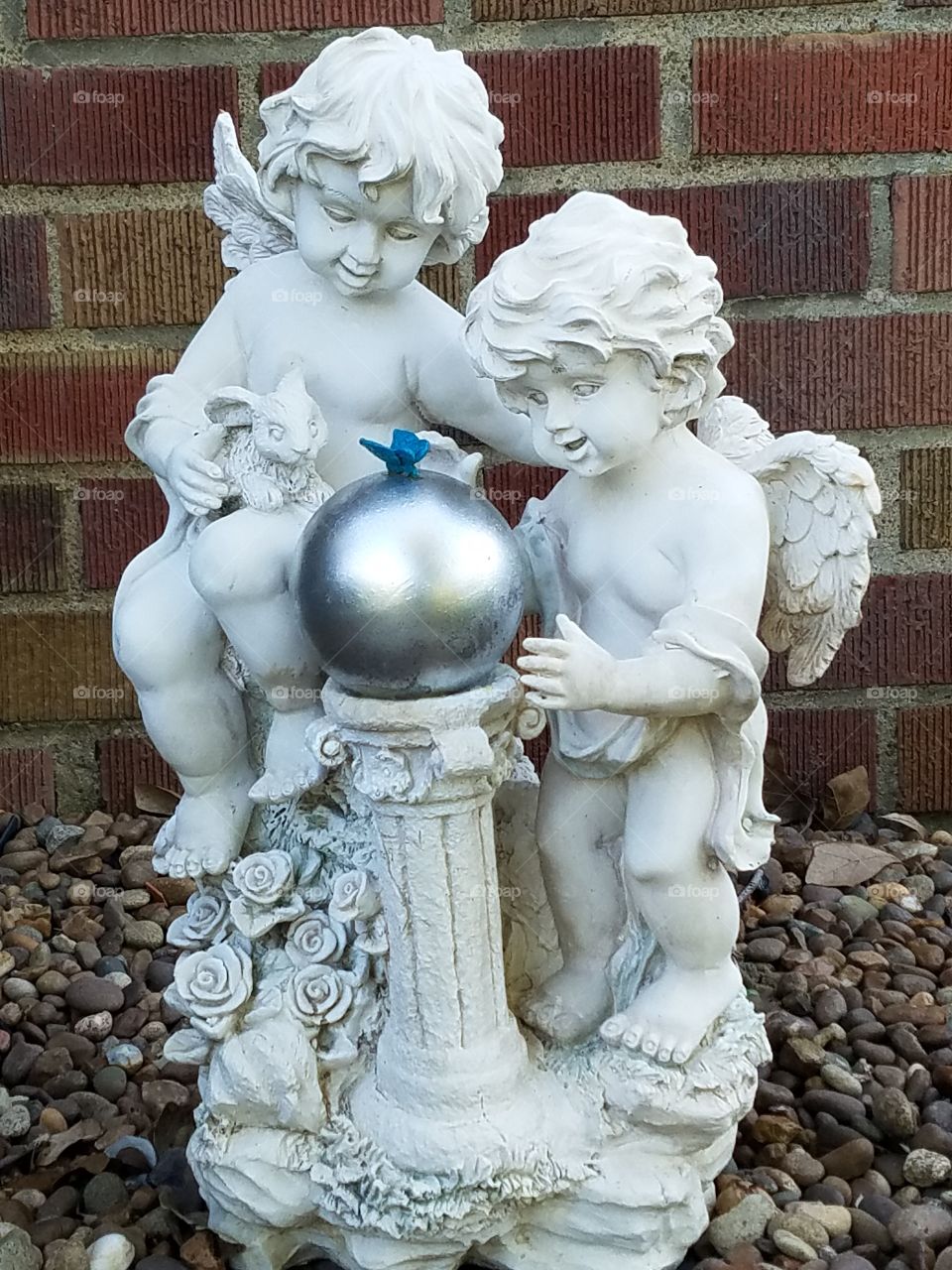 Angels  looking into a mirrored ball