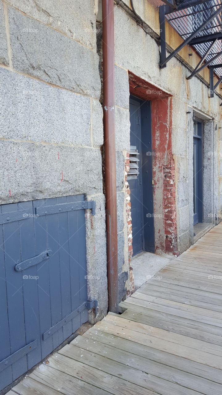 Interesting old weathered building along the shoreline walkway.