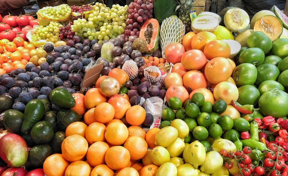 Market with various colorful fresh fruits and vegetables