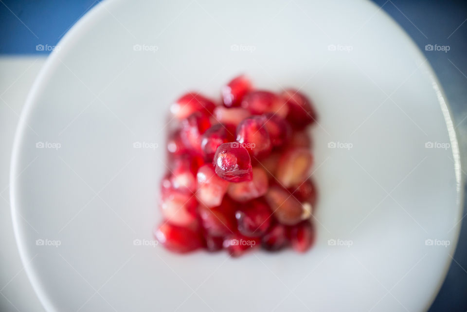 a top view of a pyramid of pomegranate pearls