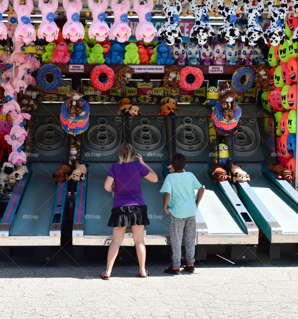 Playing mid way games at the fair